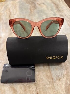 Wildfox “Monroe” Transparent Pink Cat-Eye Sunglasses with Green Lenses